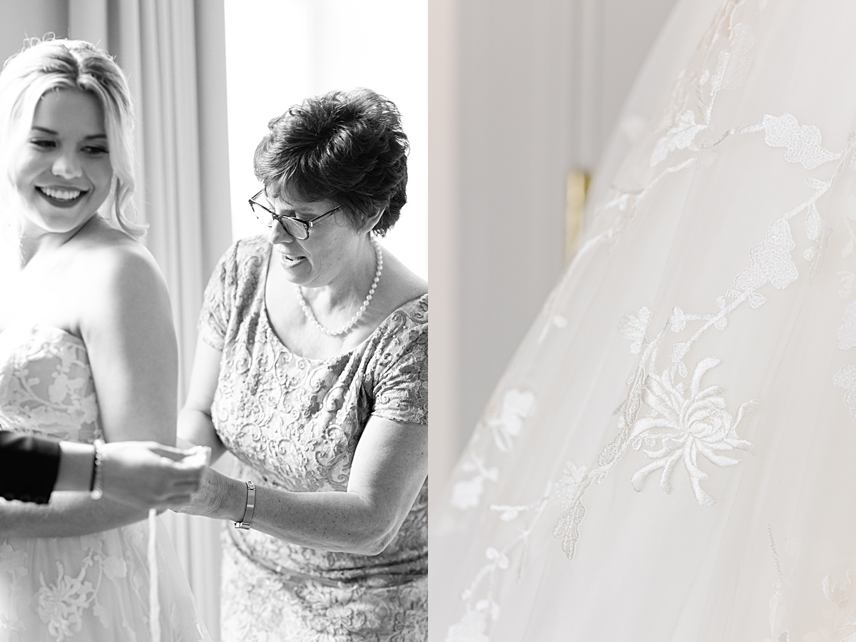 Mother of the bride helping her daughter put on her wedding dress.