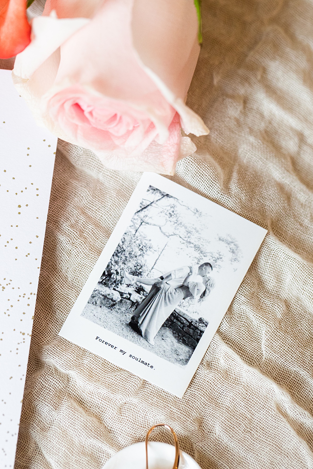 The bridal details styled with pastel pink blooms that match the bride's bouquet.