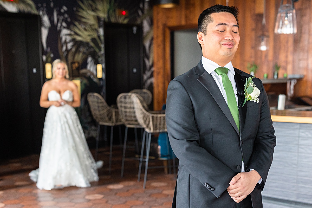 First look reaction with bride and groom before the ceremony at The Virginian Hotel in Lynchburg, Virginia.