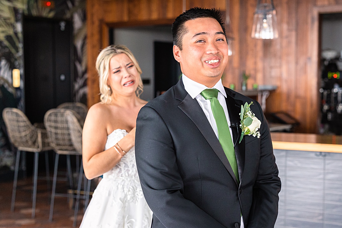 First look reaction with bride and groom before the ceremony at The Virginian Hotel in Lynchburg, Virginia.