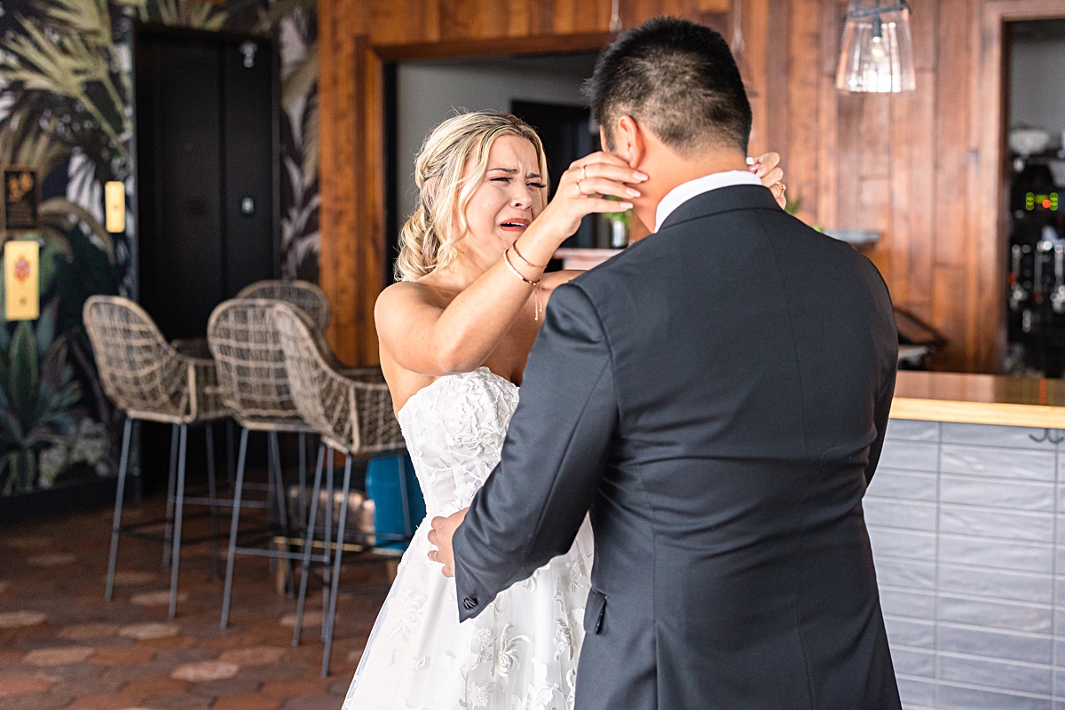 First look reaction with bride and groom before the ceremony at The Virginian Hotel in Lynchburg, Virginia.