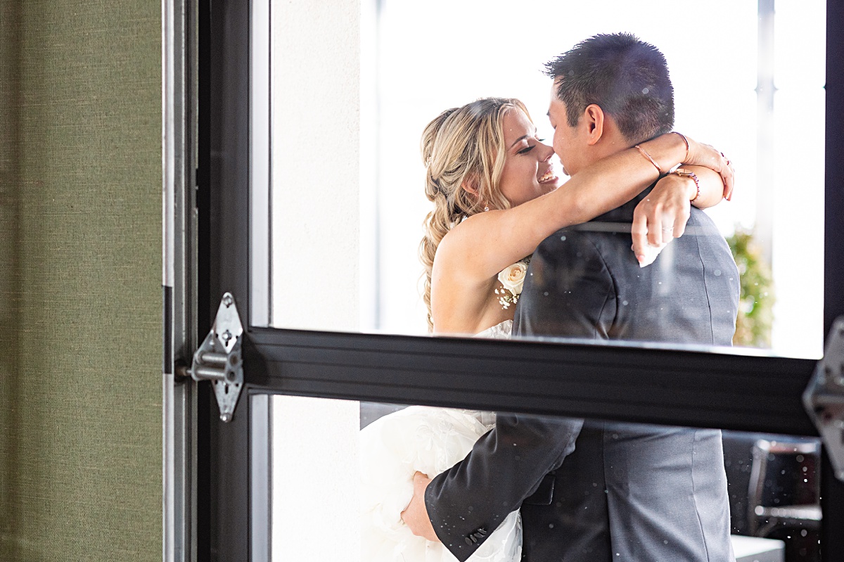 First look reaction with bride and groom before the ceremony at The Virginian Hotel in Lynchburg, Virginia.