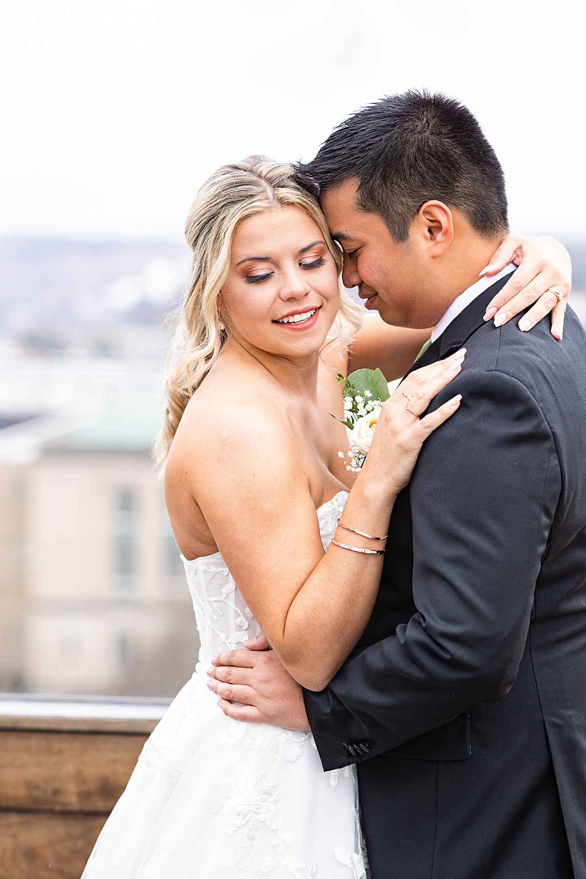 Portrait of the bride and groom on the rooftop of The Virginian Hotel in Lynchburg, Virginia.