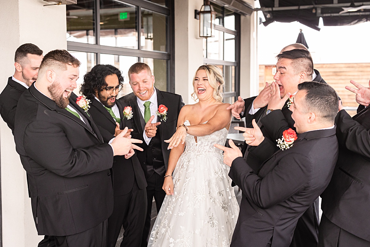 First Look reaction with the bride and the groomsmen at the rooftop of the Skyline at The Virginian Hotel in Lynchburg, Virginia.