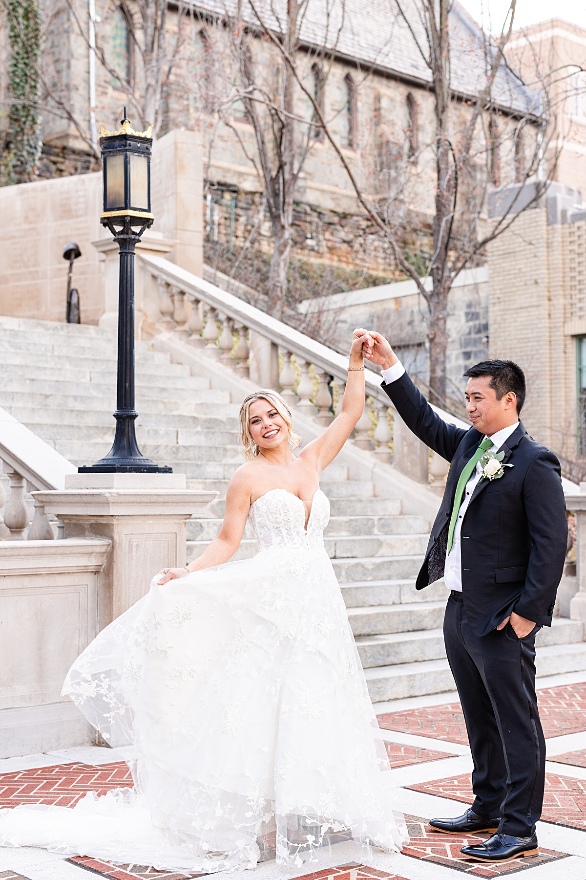 Portrait of the bride and groom on the stairs of Monument Terrace in Downtown Lynchburg before their ceremony at The Virginian Hotel in Lynchburg, Virginia.