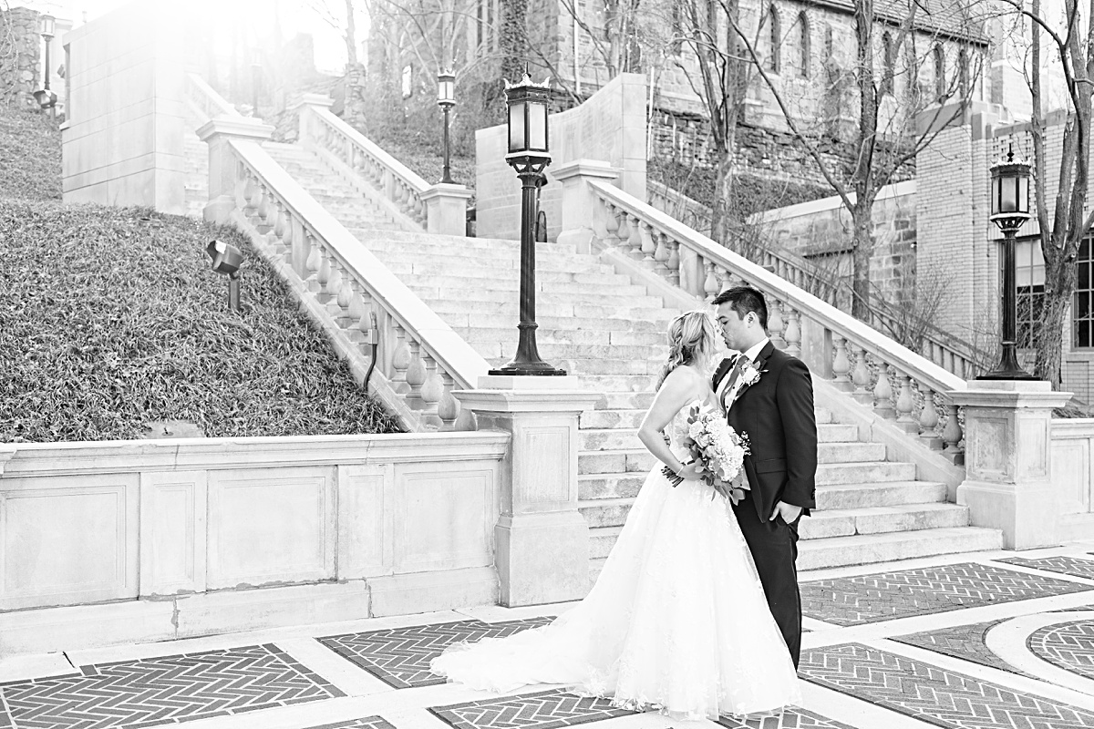 Portrait of the bride and groom on the stairs of Monument Terrace in Downtown Lynchburg before their ceremony at The Virginian Hotel in Lynchburg, Virginia.