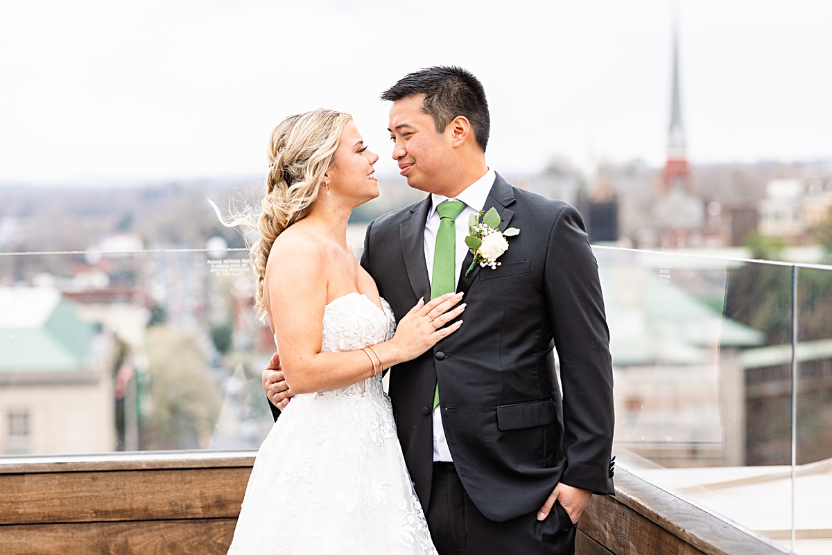 Portrait of the bride and groom on the stairs of Monument Terrace in Downtown Lynchburg at The Virginian Hotel in Lynchburg, Virginia.