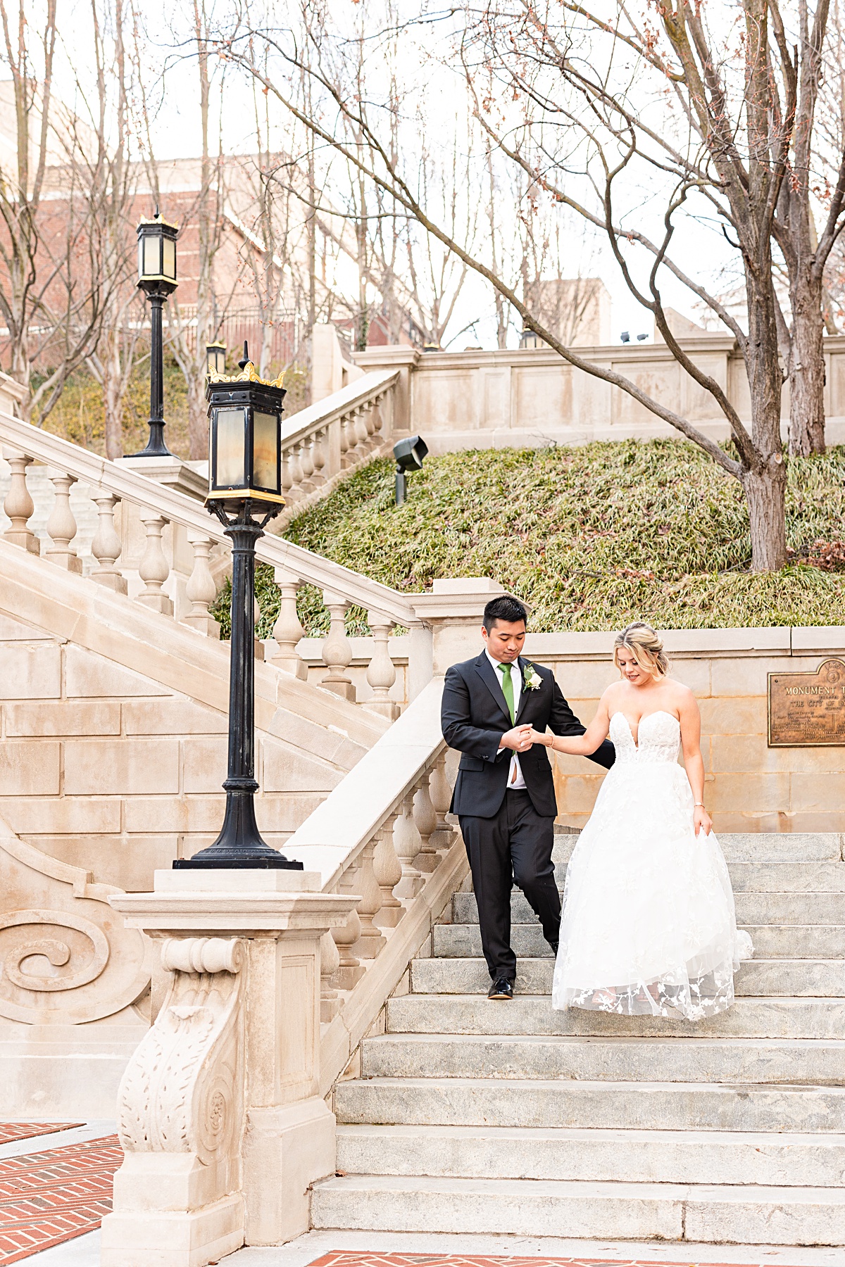 Portrait of the bride and groom on the stairs of Monument Terrace in Downtown Lynchburg at The Virginian Hotel in Lynchburg, Virginia.