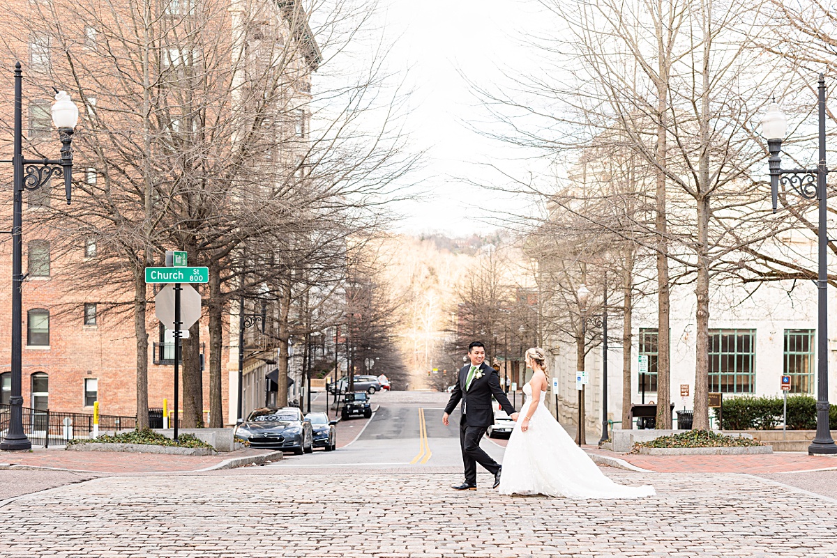 Portrait of the bride and groom on the stairs of Monument Terrace in Downtown Lynchburg at The Virginian Hotel in Lynchburg, Virginia.