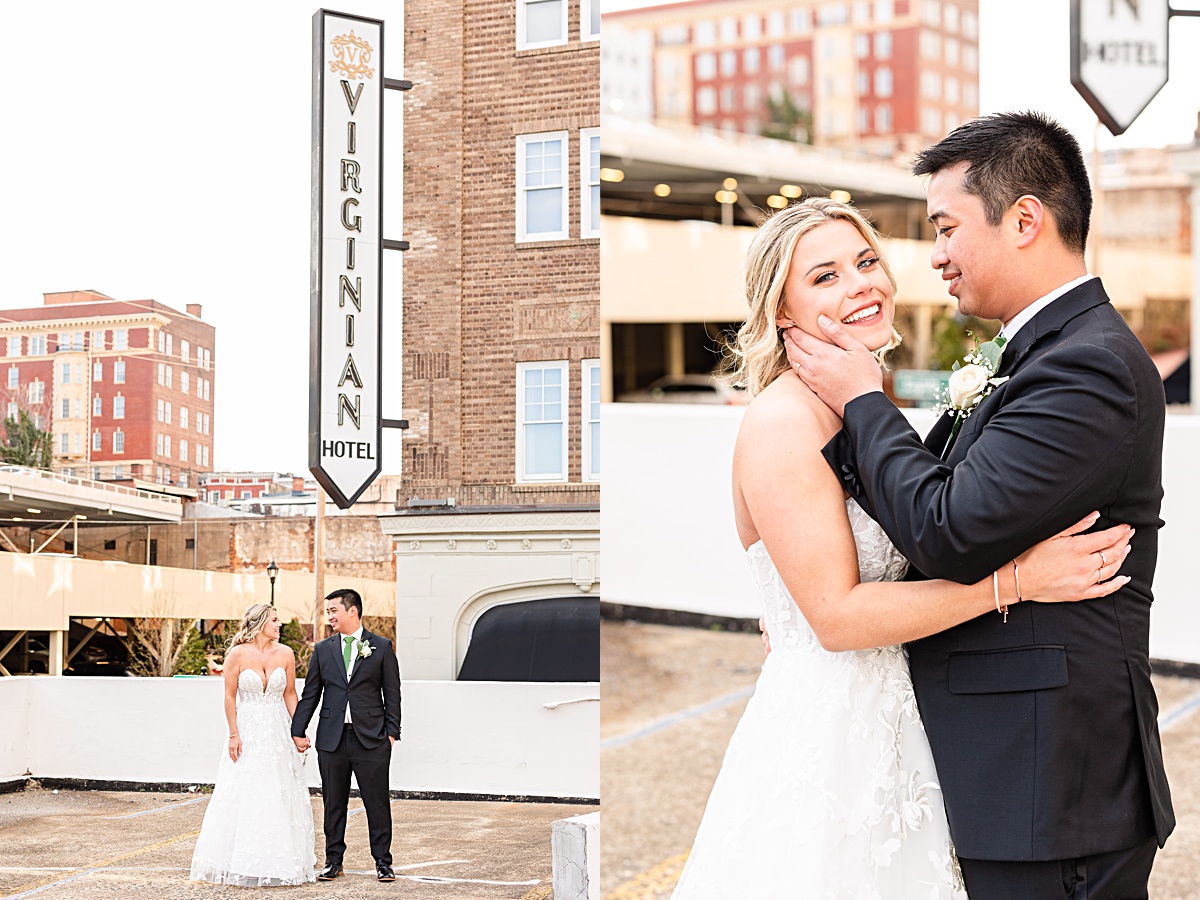 Portrait of the bride and groom in front of the sign of The Virginian Hotel in Lynchburg, Virginia.