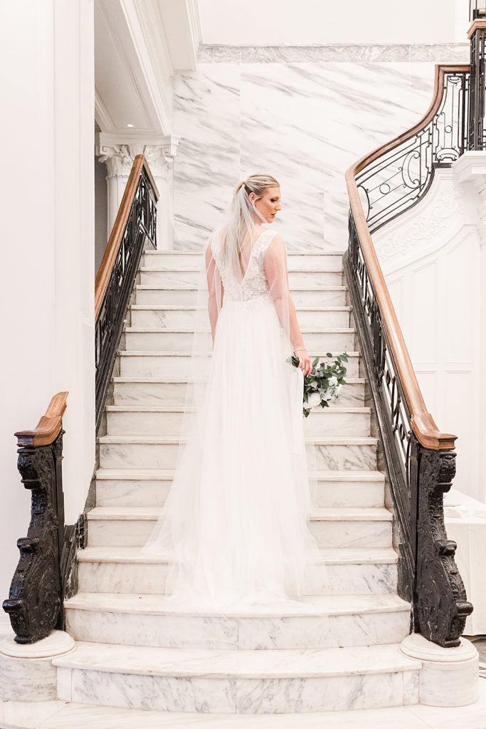 Bridal portraits on the stairs in the ballroom at the Virginian Hotel in Lynchburg, Virginia.