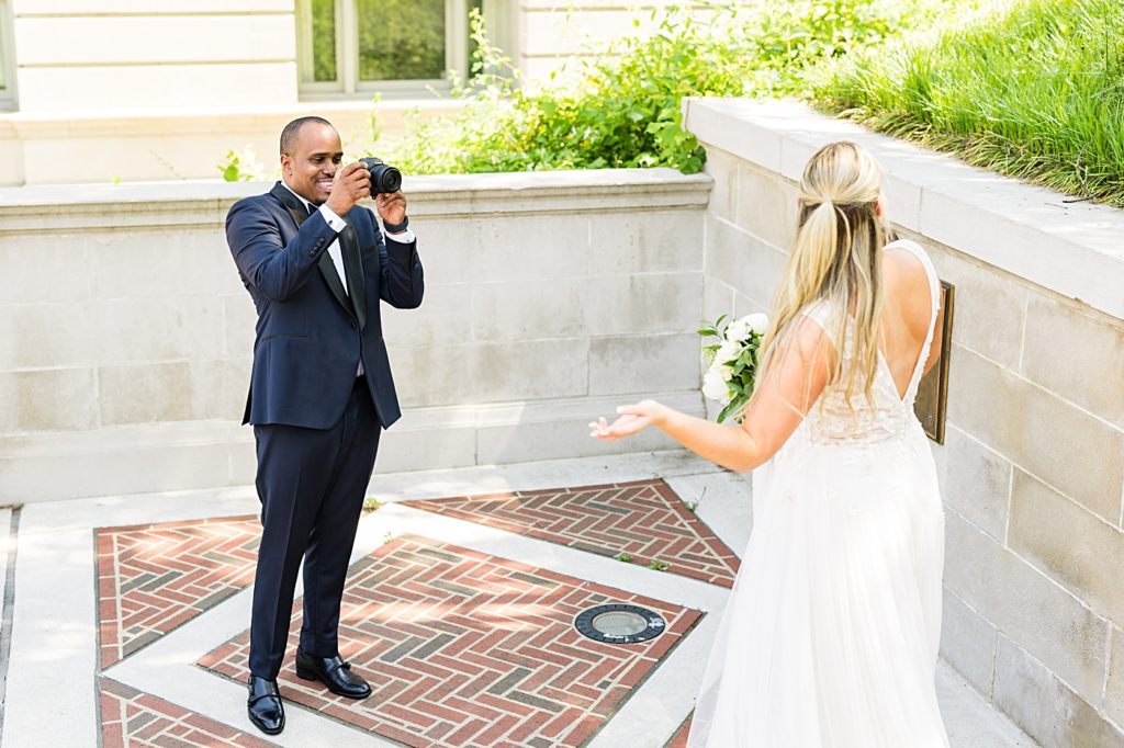 Groom takes his bride's portraits at Monument Terrace in Downtown Lynchburg, Virginia.