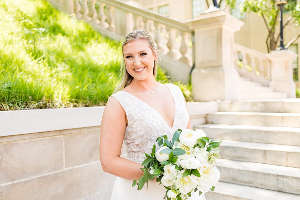 Groom takes his bride's portraits at Monument Terrace in Downtown Lynchburg, Virginia.