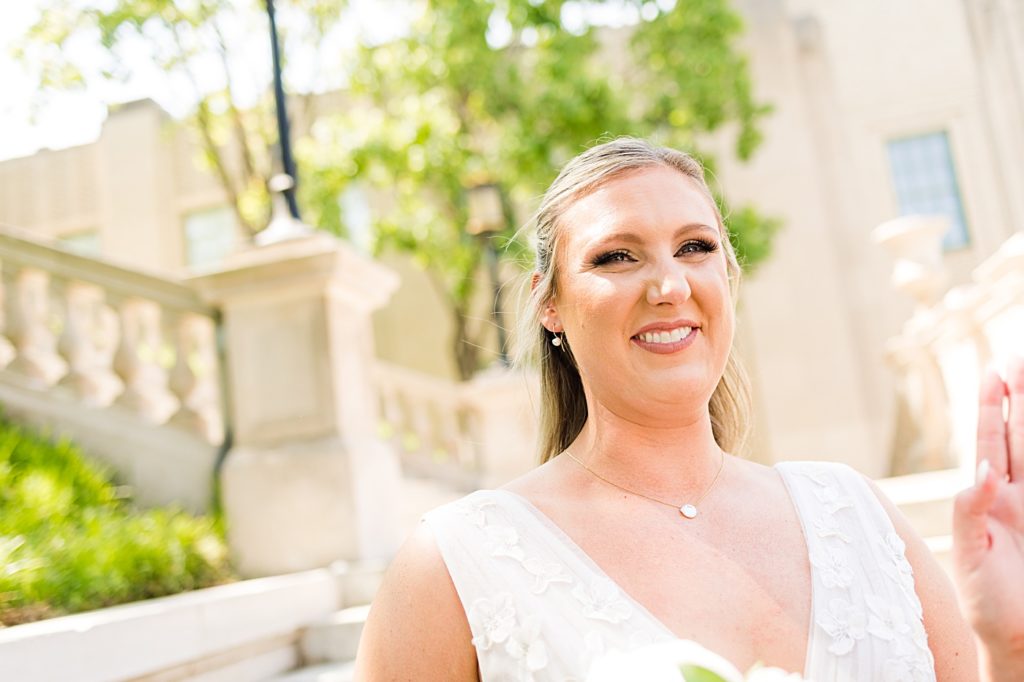 Groom takes his bride's portraits at Monument Terrace in Downtown Lynchburg, Virginia.