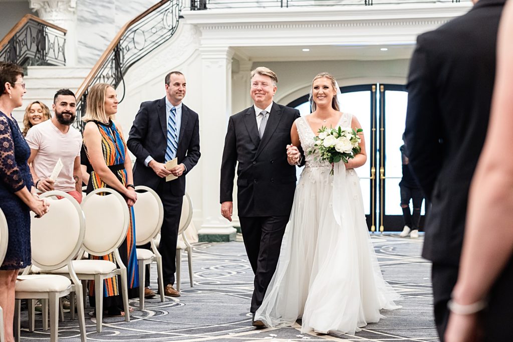 Bride walking down the aisle at the Virginian Hotel in Lynchburg, Virginia.