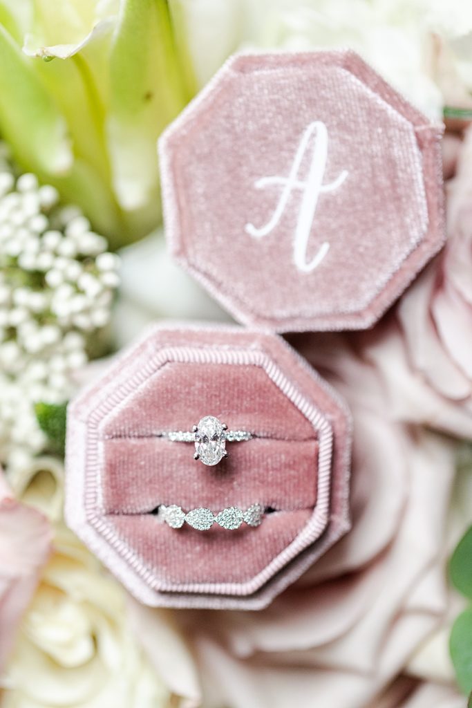 Bridal details photo with dusty rose wedding colors, pastel pink flowers, and classic pearl details.