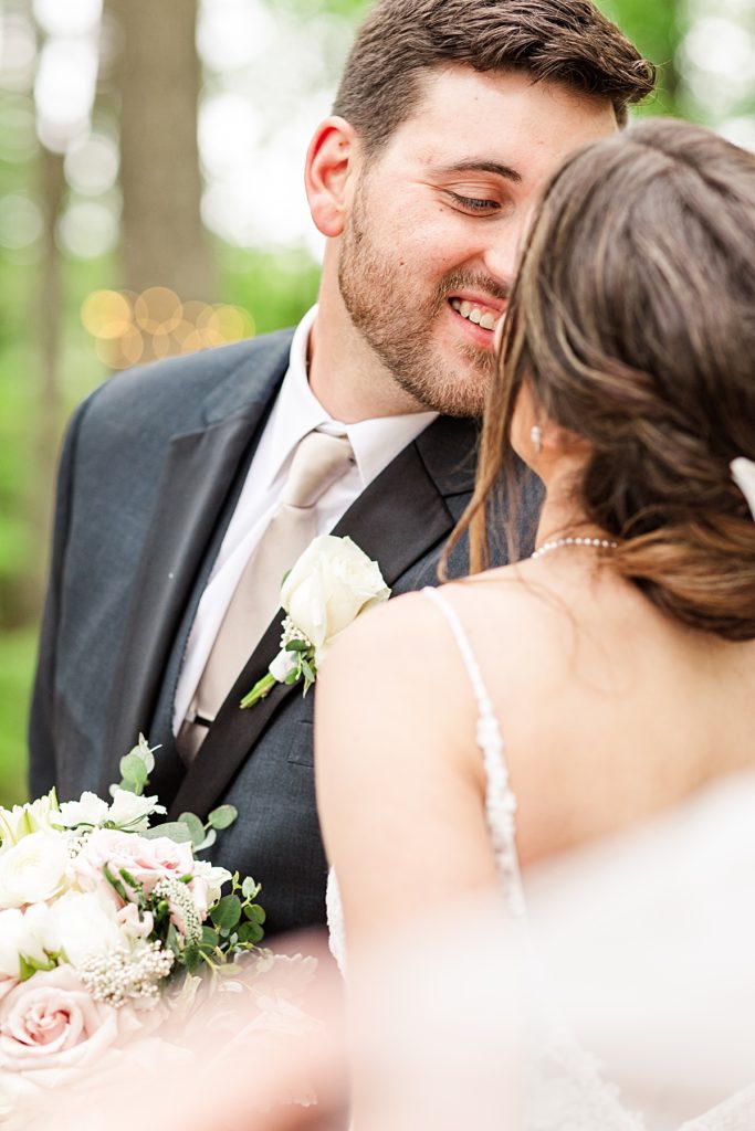 Romantic whimsy bride and groom portraits under the twinkle lights at Sorella Farms in Lynchburg, Virginia.