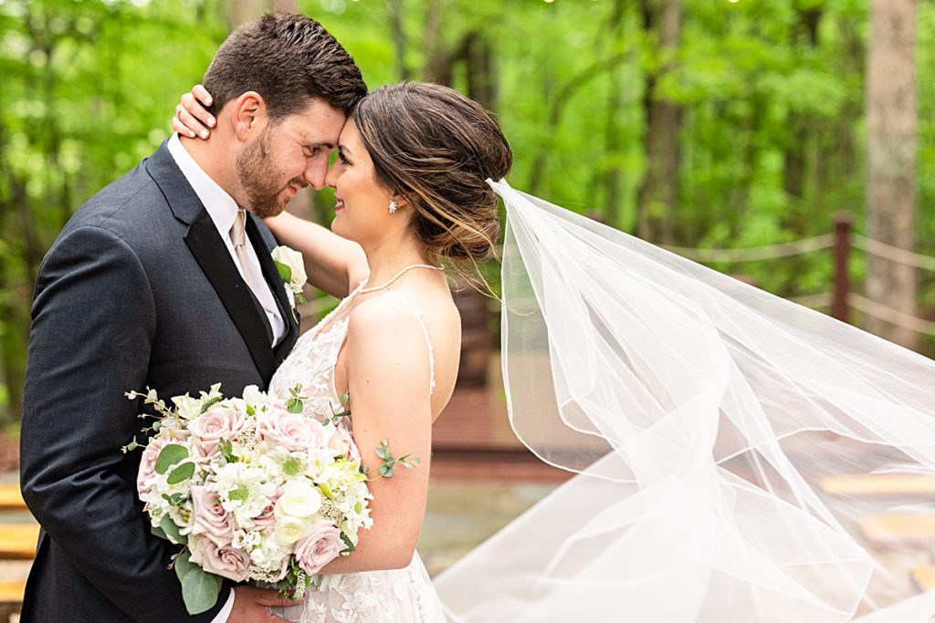 Romantic whimsy bride and groom portraits under the twinkle lights at Sorella Farms in Lynchburg, Virginia.