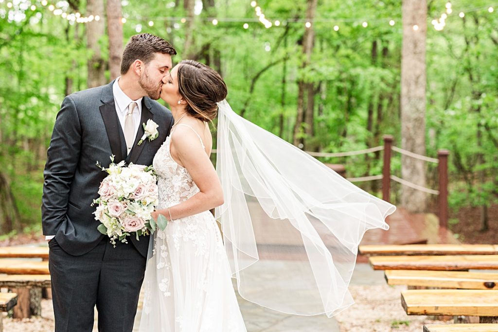 Romantic whimsy bride and groom portraits under the twinkle lights at Sorella Farms in Lynchburg, Virginia.