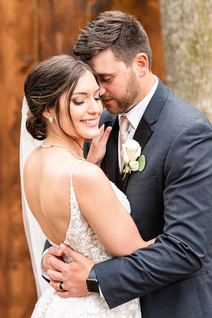 Romantic whimsy bride and groom portraits under the twinkle lights at Sorella Farms in Lynchburg, Virginia.