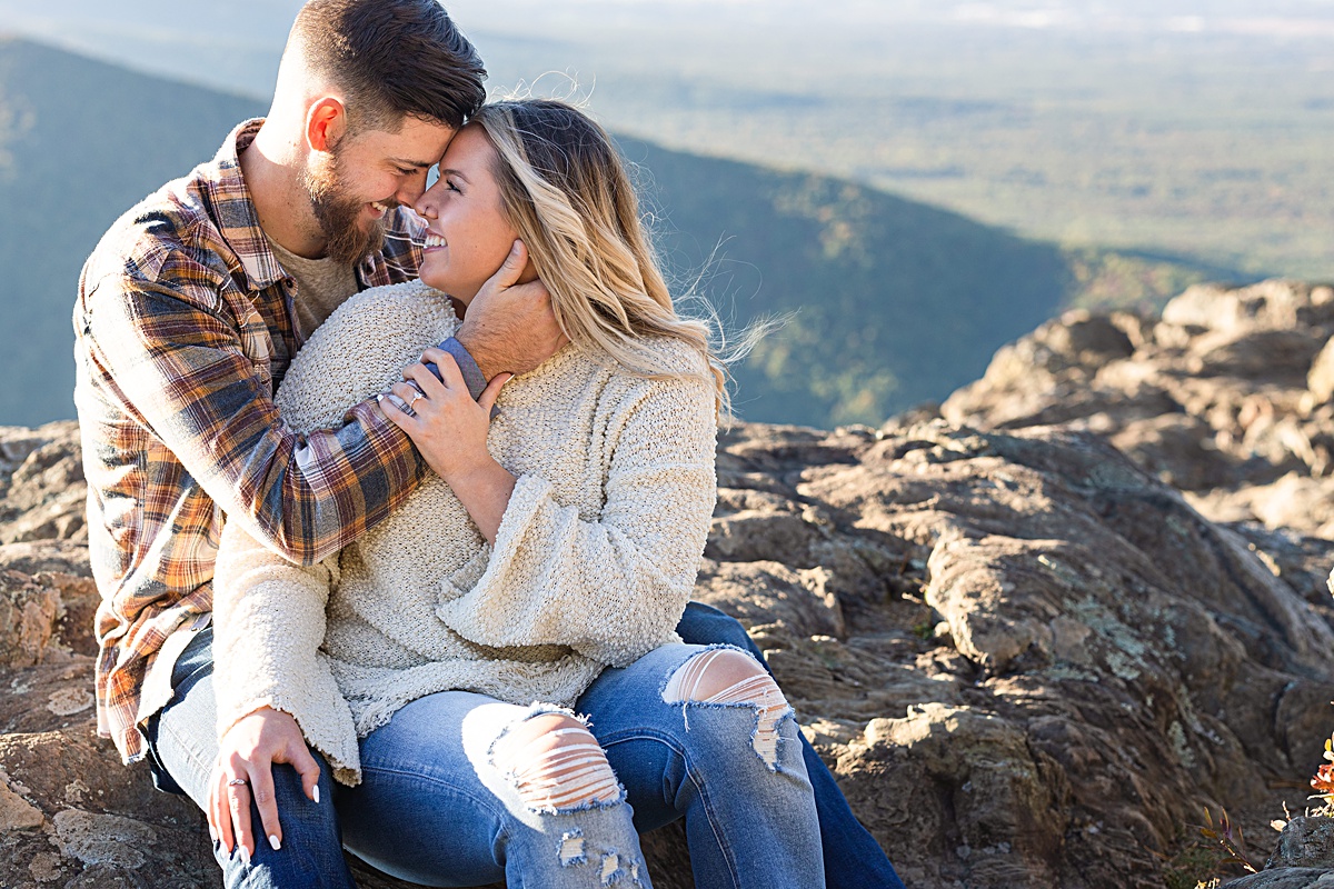 This Ravens Roost Overlook engagement session offers the perfect fall view of the Blue Ridge Mountains near Charlottesville, Virginia.