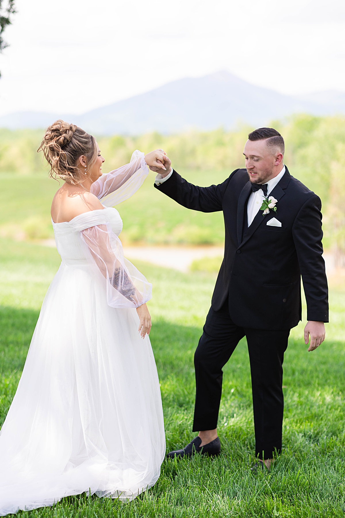 This elegant garden wedding at Cedar Oaks Farm features a classic car, stunning ceremony mountain view, unique bridal details, a boxer puppy, and a surprise baby gender reveal cake!