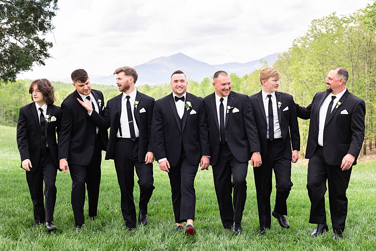 This elegant garden wedding at Cedar Oaks Farm features a classic car, stunning ceremony mountain view, unique bridal details, a boxer puppy, and a surprise baby gender reveal cake!