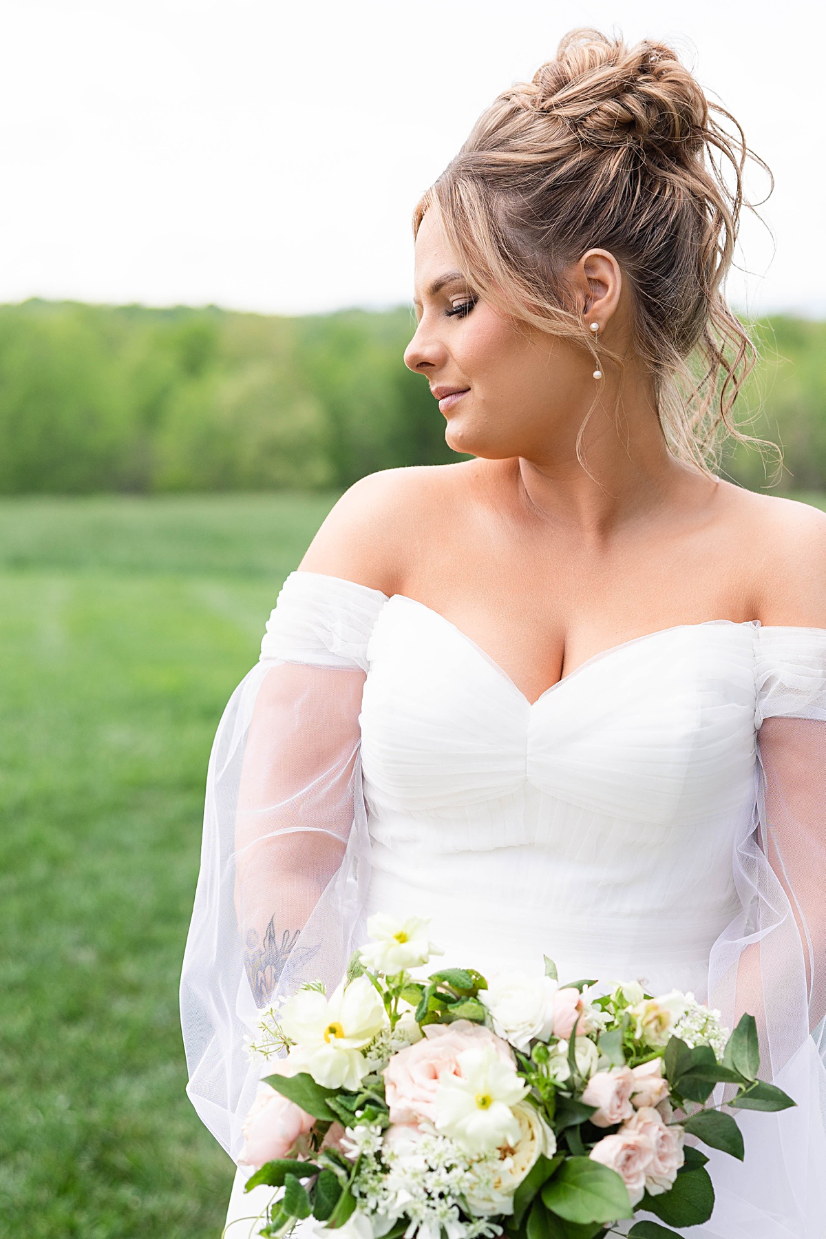 This elegant garden wedding at Cedar Oaks Farm features a classic car, stunning ceremony mountain view, unique bridal details, a boxer puppy, and a surprise baby gender reveal cake!