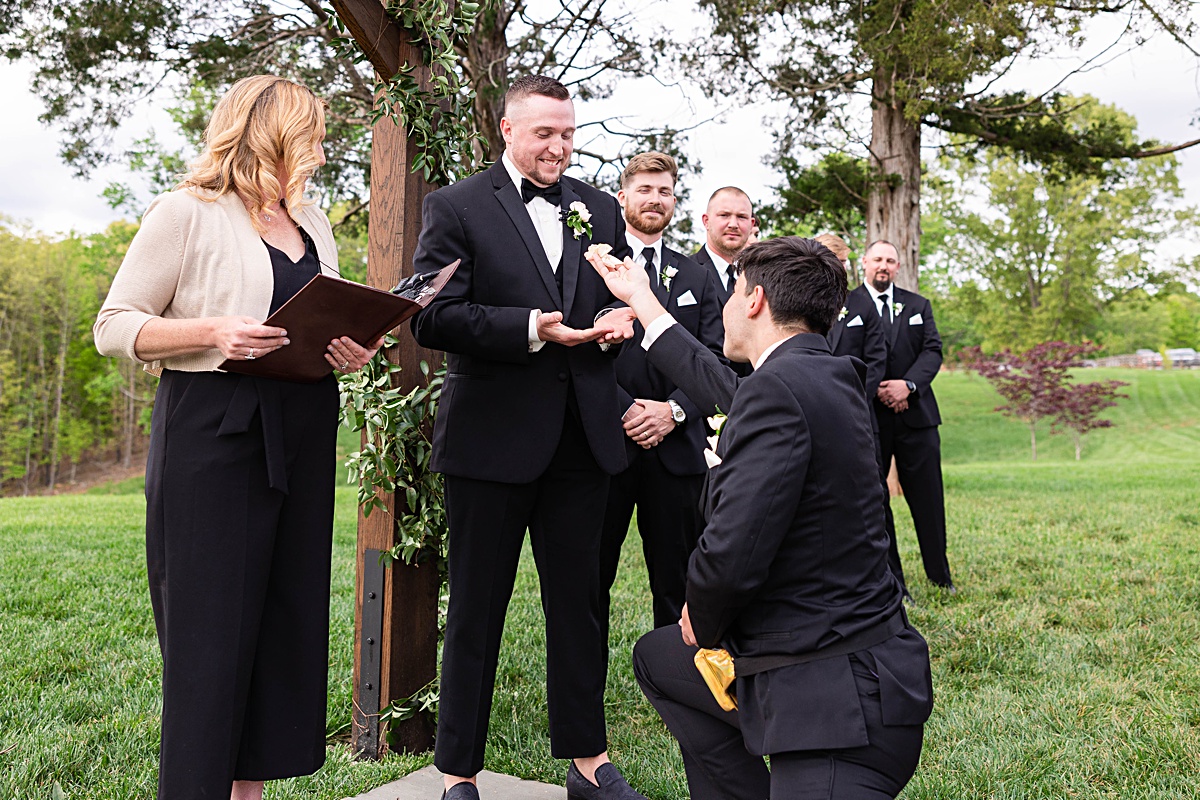 This elegant garden wedding at Cedar Oaks Farm features a classic car, stunning ceremony mountain view, unique bridal details, a boxer puppy, and a surprise baby gender reveal cake!