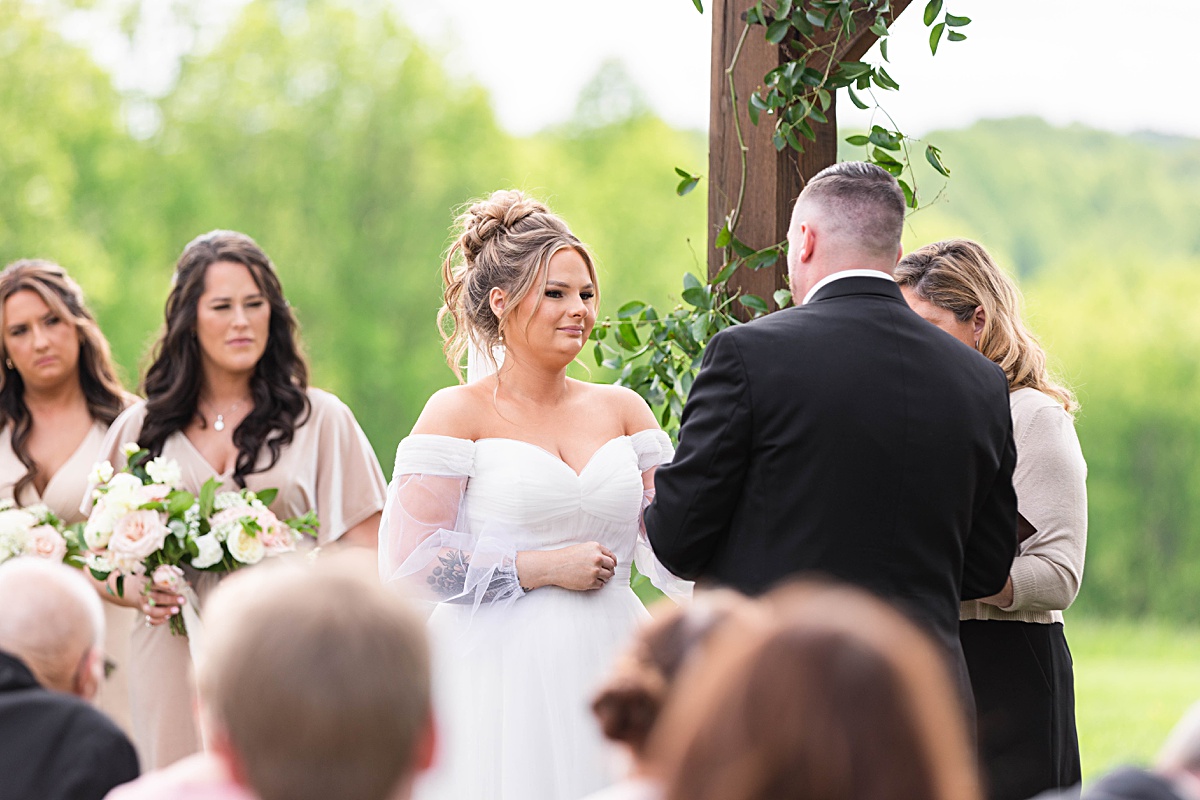 This elegant garden wedding at Cedar Oaks Farm features a classic car, stunning ceremony mountain view, unique bridal details, a boxer puppy, and a surprise baby gender reveal cake!