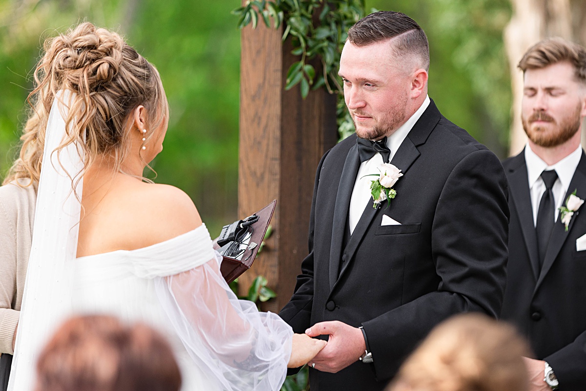 This elegant garden wedding at Cedar Oaks Farm features a classic car, stunning ceremony mountain view, unique bridal details, a boxer puppy, and a surprise baby gender reveal cake!