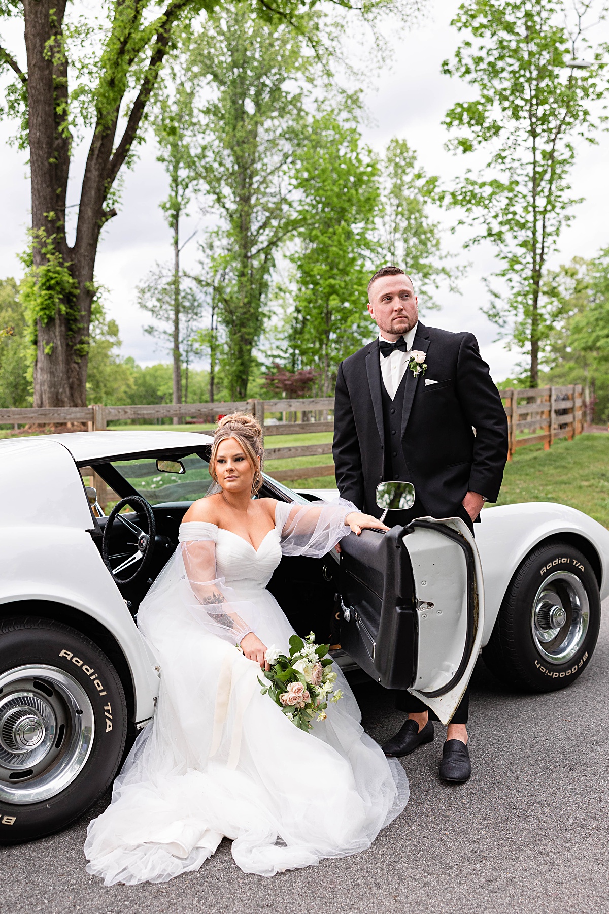 This elegant garden wedding at Cedar Oaks Farm features a classic car, stunning ceremony mountain view, unique bridal details, a boxer puppy, and a surprise baby gender reveal cake!