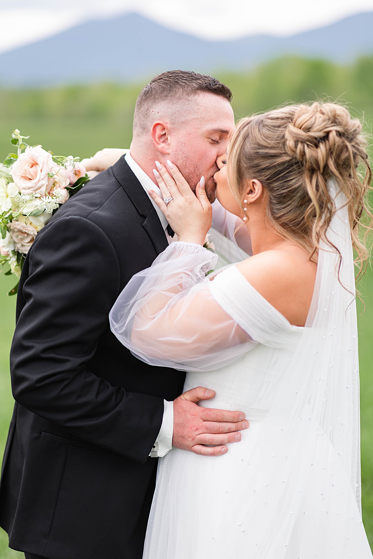 This elegant garden wedding at Cedar Oaks Farm features a classic car, stunning ceremony mountain view, unique bridal details, a boxer puppy, and a surprise baby gender reveal cake!