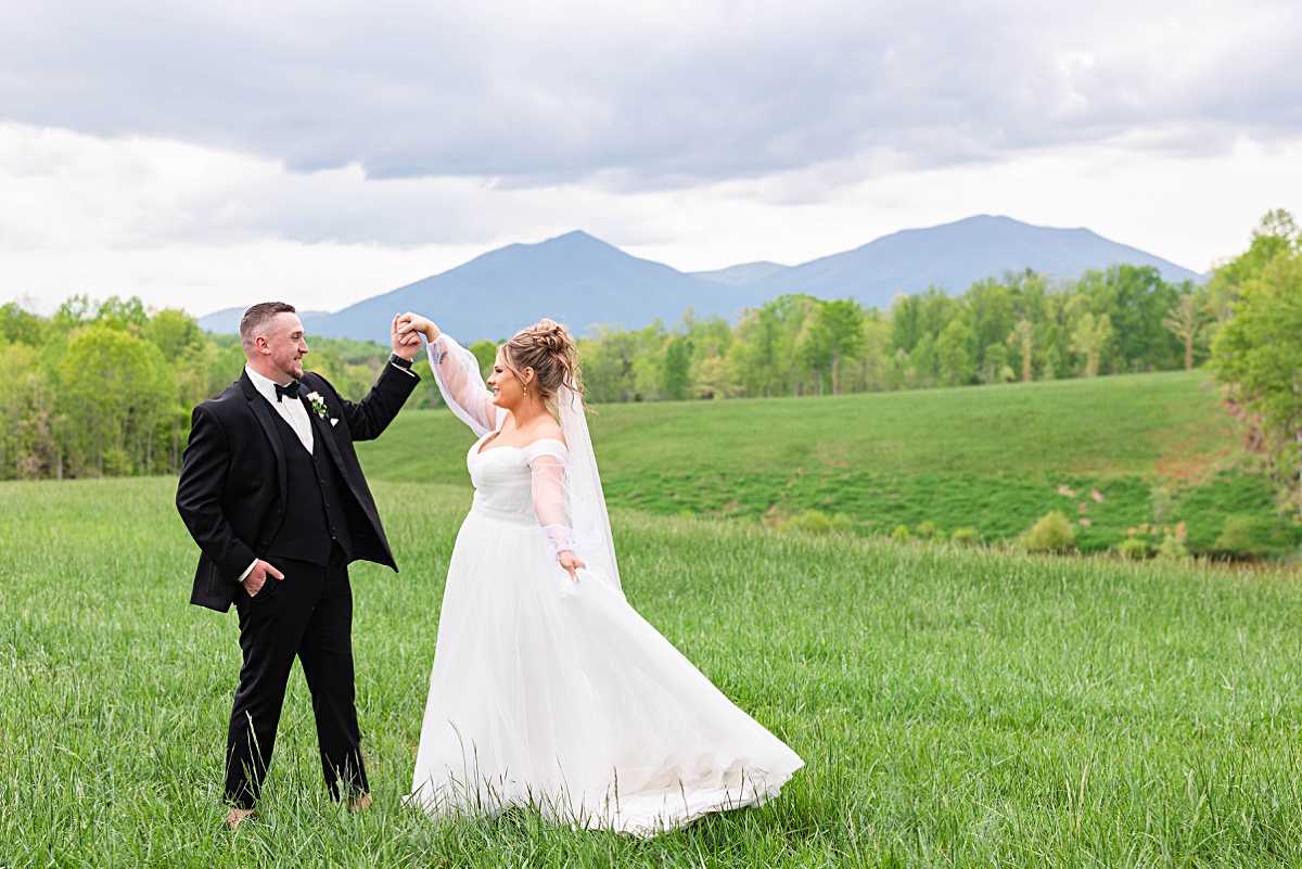 This elegant garden wedding at Cedar Oaks Farm features a classic car, stunning ceremony mountain view, unique bridal details, a boxer puppy, and a surprise baby gender reveal cake!