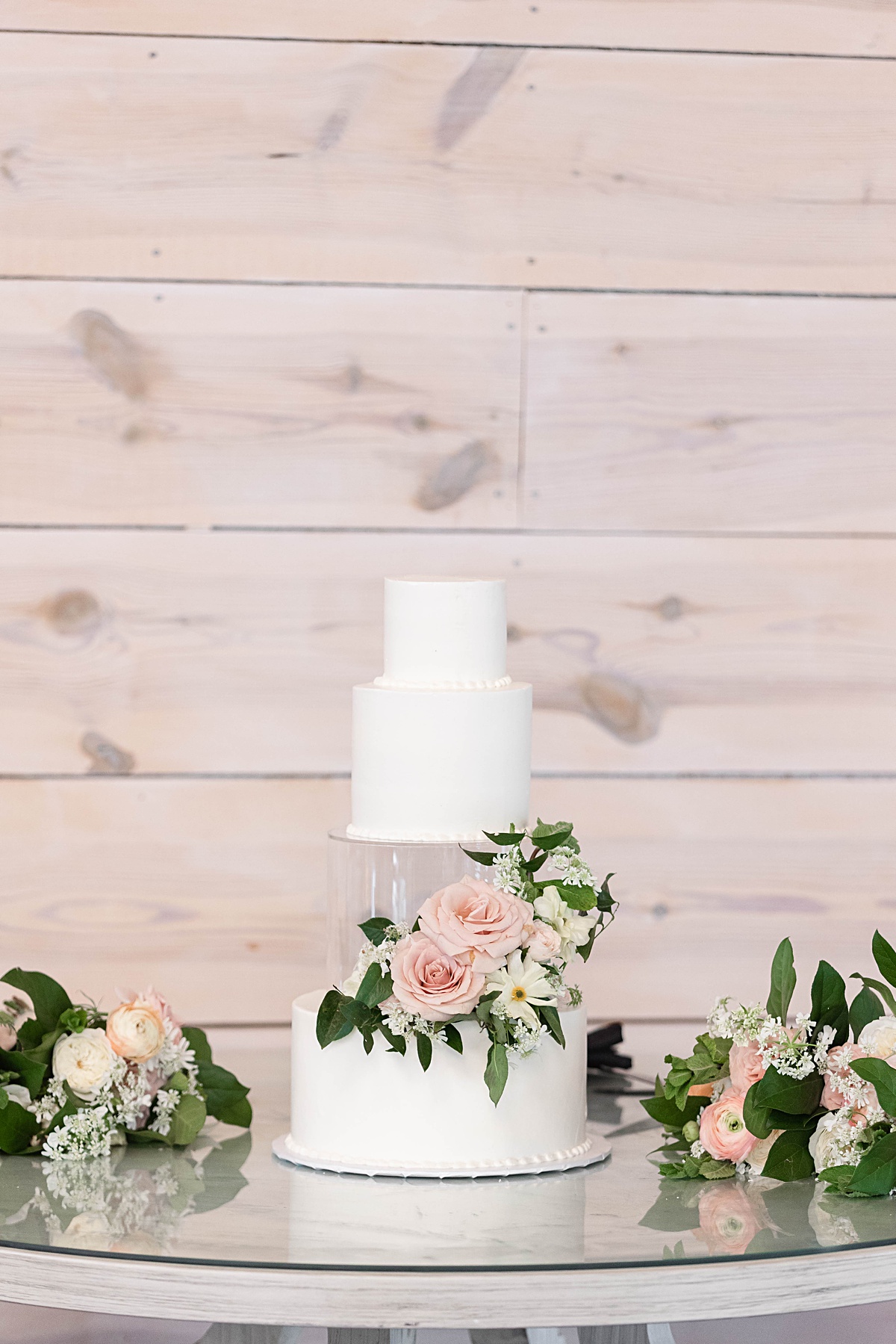 This elegant garden wedding at Cedar Oaks Farm features a classic car, stunning ceremony mountain view, unique bridal details, a boxer puppy, and a surprise baby gender reveal cake!