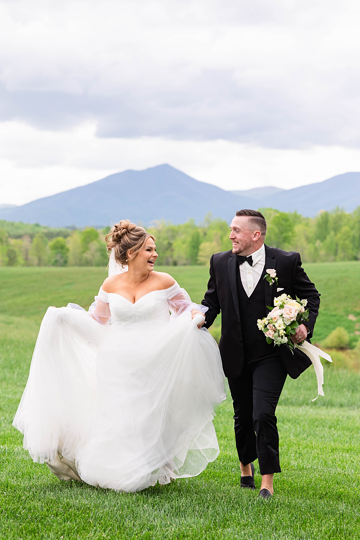 This elegant garden wedding at Cedar Oaks Farm features a classic car, stunning ceremony mountain view, unique bridal details, a boxer puppy, and a surprise baby gender reveal cake!