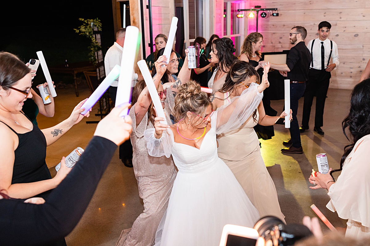 This elegant garden wedding at Cedar Oaks Farm features a classic car, stunning ceremony mountain view, unique bridal details, a boxer puppy, and a surprise baby gender reveal cake!