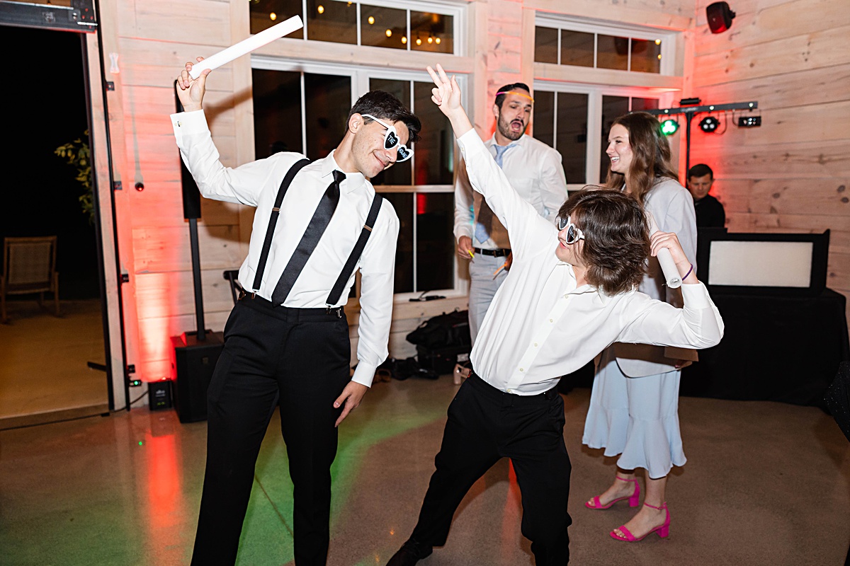 This elegant garden wedding at Cedar Oaks Farm features a classic car, stunning ceremony mountain view, unique bridal details, a boxer puppy, and a surprise baby gender reveal cake!