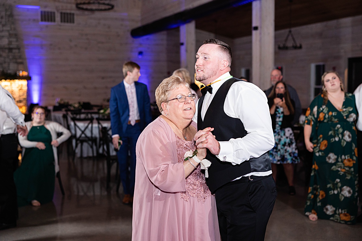 This elegant garden wedding at Cedar Oaks Farm features a classic car, stunning ceremony mountain view, unique bridal details, a boxer puppy, and a surprise baby gender reveal cake!