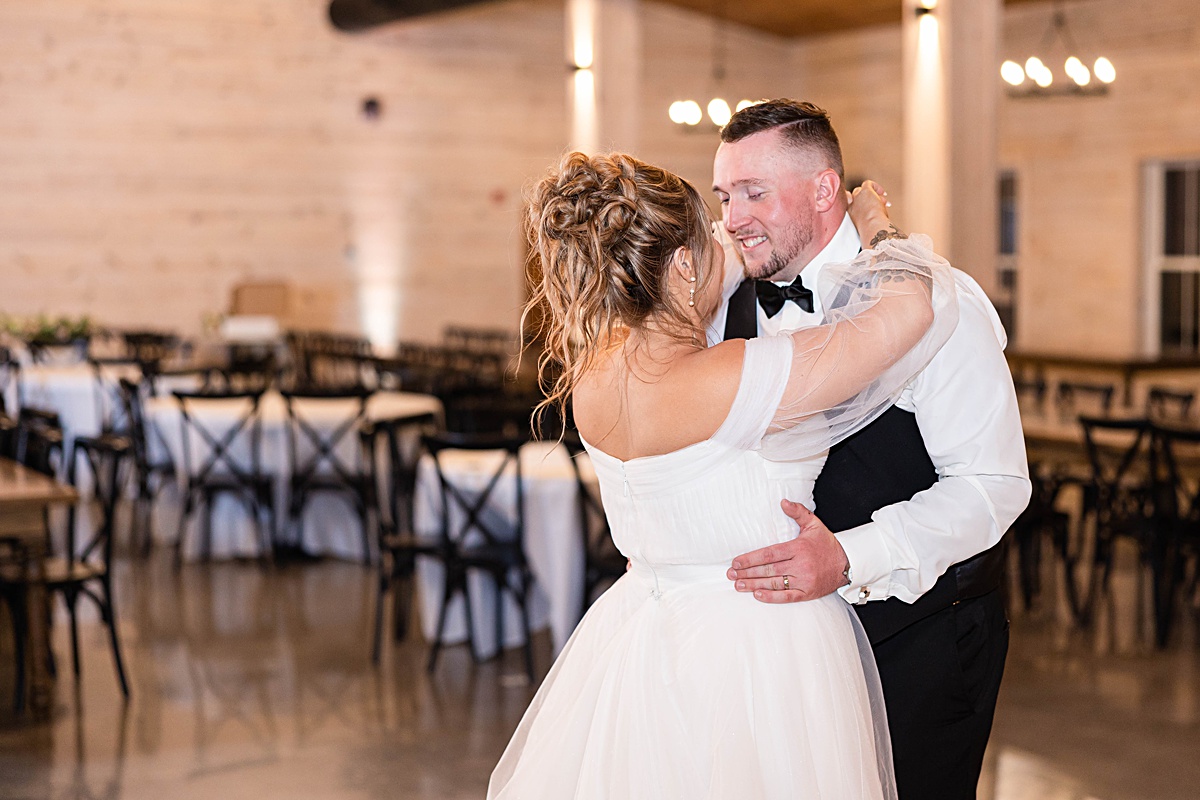 This elegant garden wedding at Cedar Oaks Farm features a classic car, stunning ceremony mountain view, unique bridal details, a boxer puppy, and a surprise baby gender reveal cake!