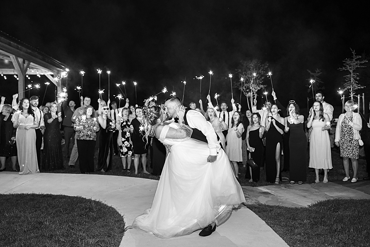 This elegant garden wedding at Cedar Oaks Farm features a classic car, stunning ceremony mountain view, unique bridal details, a boxer puppy, and a surprise baby gender reveal cake!