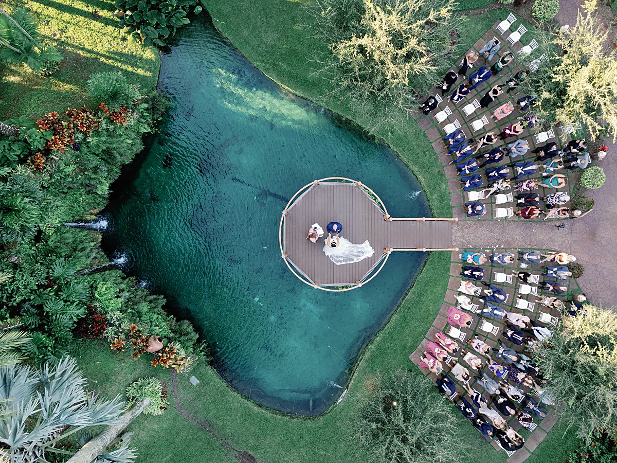 This wedding at Longan's Place in Miami, Florida features tropical palms, an emo hour dance floor, and our favorite ceremony views of the year!